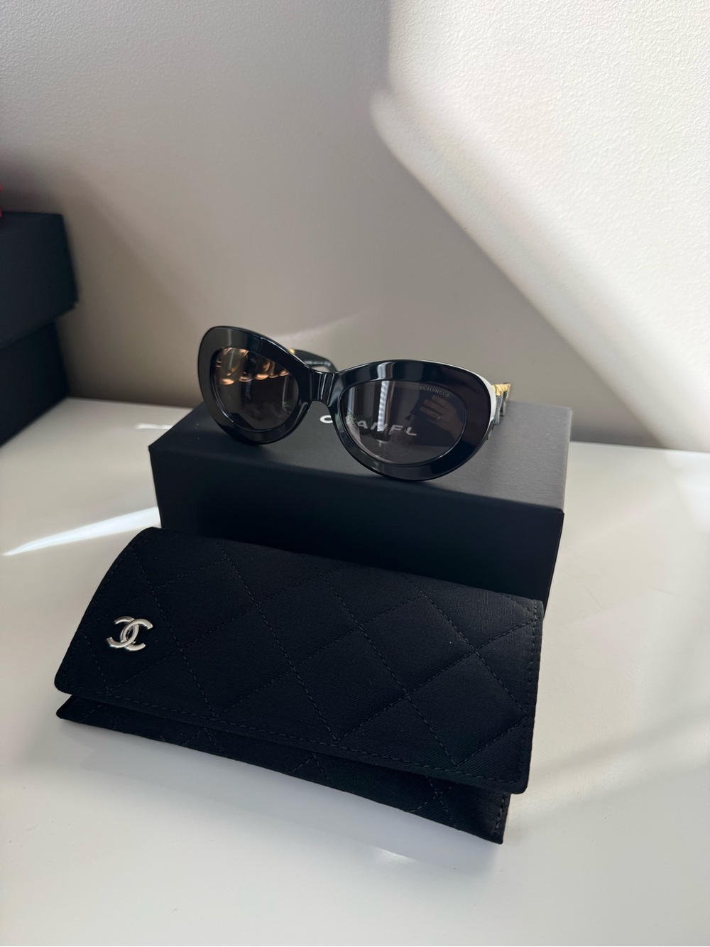 CHANEL Black Rounded Cat-Eye Sunglasses with Quilted Case